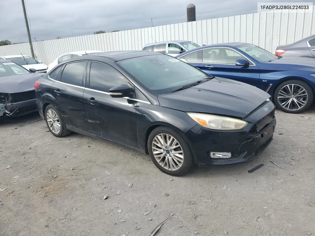 2016 Ford Focus Titanium VIN: 1FADP3J28GL224033 Lot: 80065484