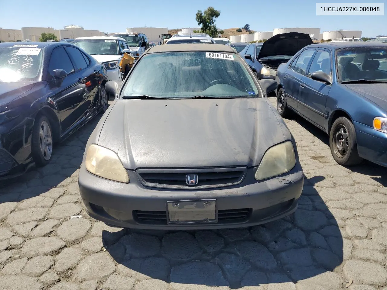 1999 Honda Civic Dx VIN: 1HGEJ6227XL086048 Lot: 69161104