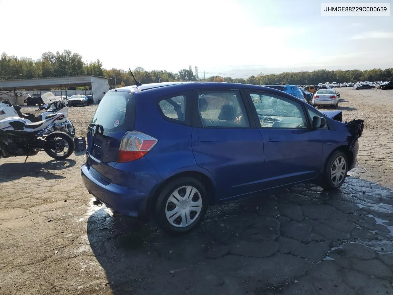 2009 Honda Fit VIN: JHMGE88229C000659 Lot: 77795354