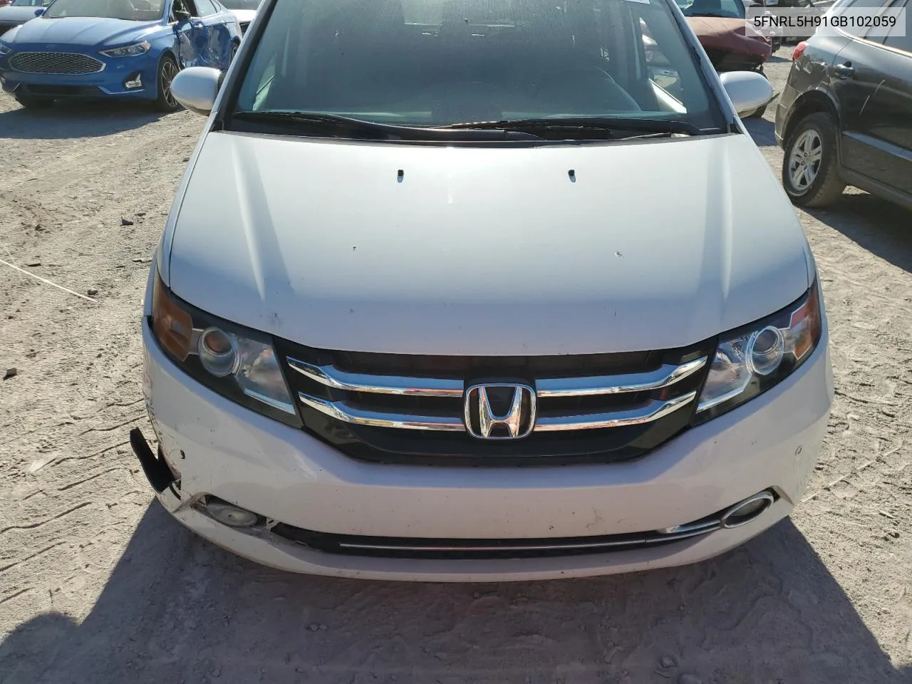 2016 Honda Odyssey Touring VIN: 5FNRL5H91GB102059 Lot: 77531864