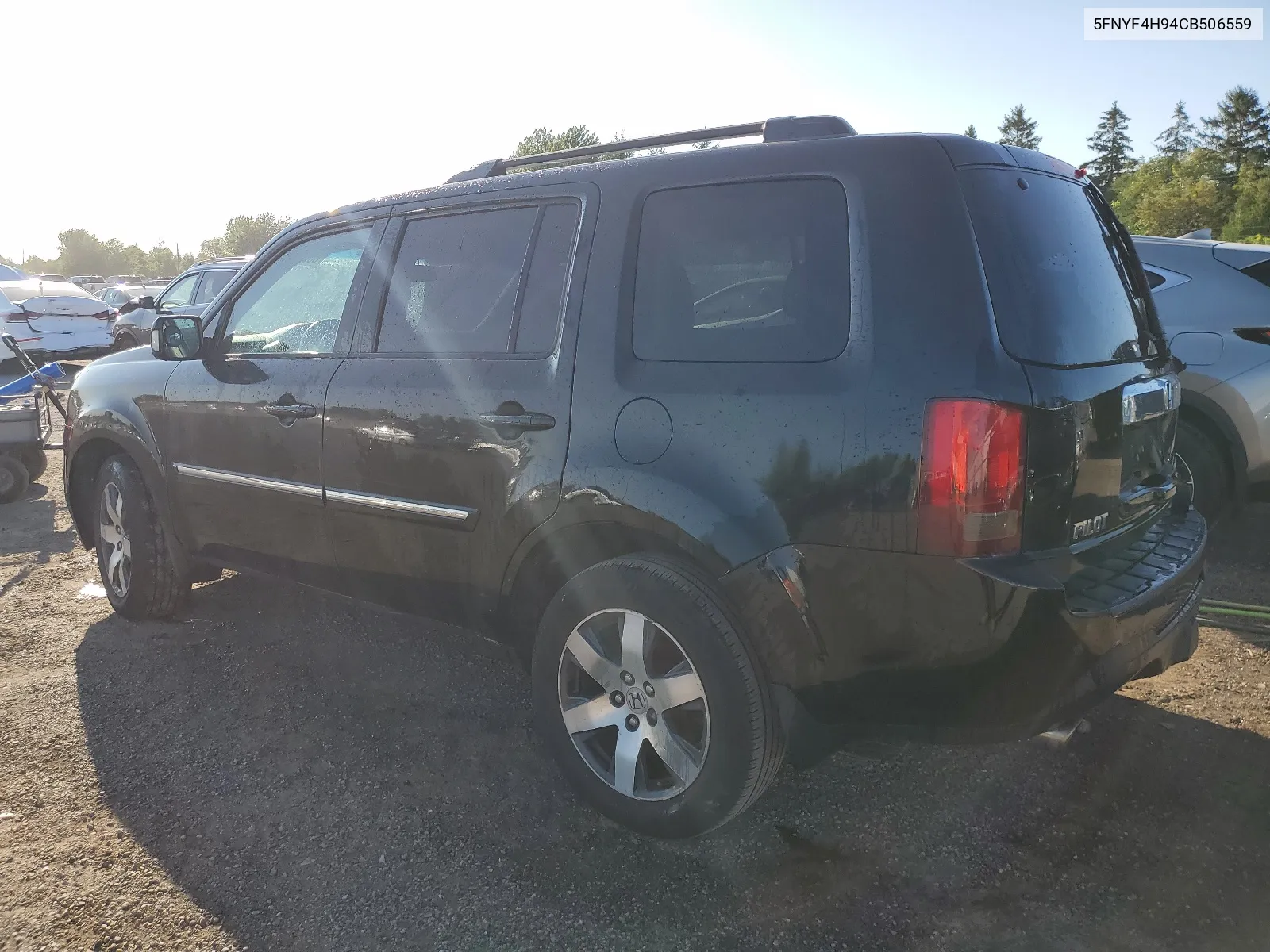 2012 Honda Pilot Touring VIN: 5FNYF4H94CB506559 Lot: 66083624