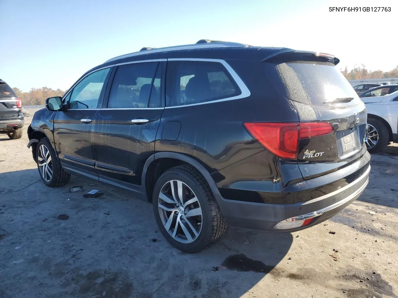 2016 Honda Pilot Touring VIN: 5FNYF6H91GB127763 Lot: 77437424