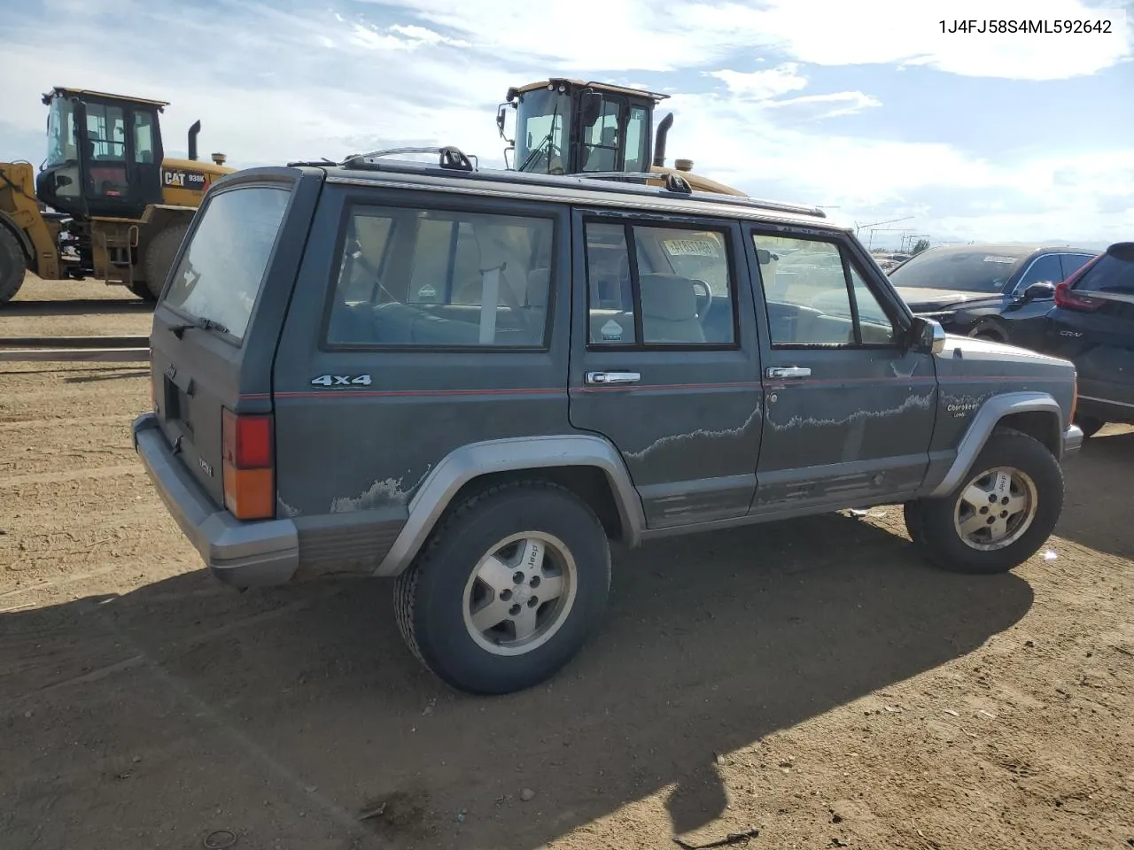 1991 Jeep Cherokee Laredo VIN: 1J4FJ58S4ML592642 Lot: 69472814