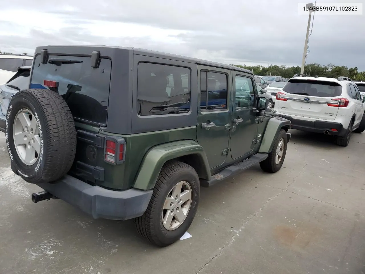 2007 Jeep Wrangler Sahara VIN: 1J4GB59107L102323 Lot: 75009274