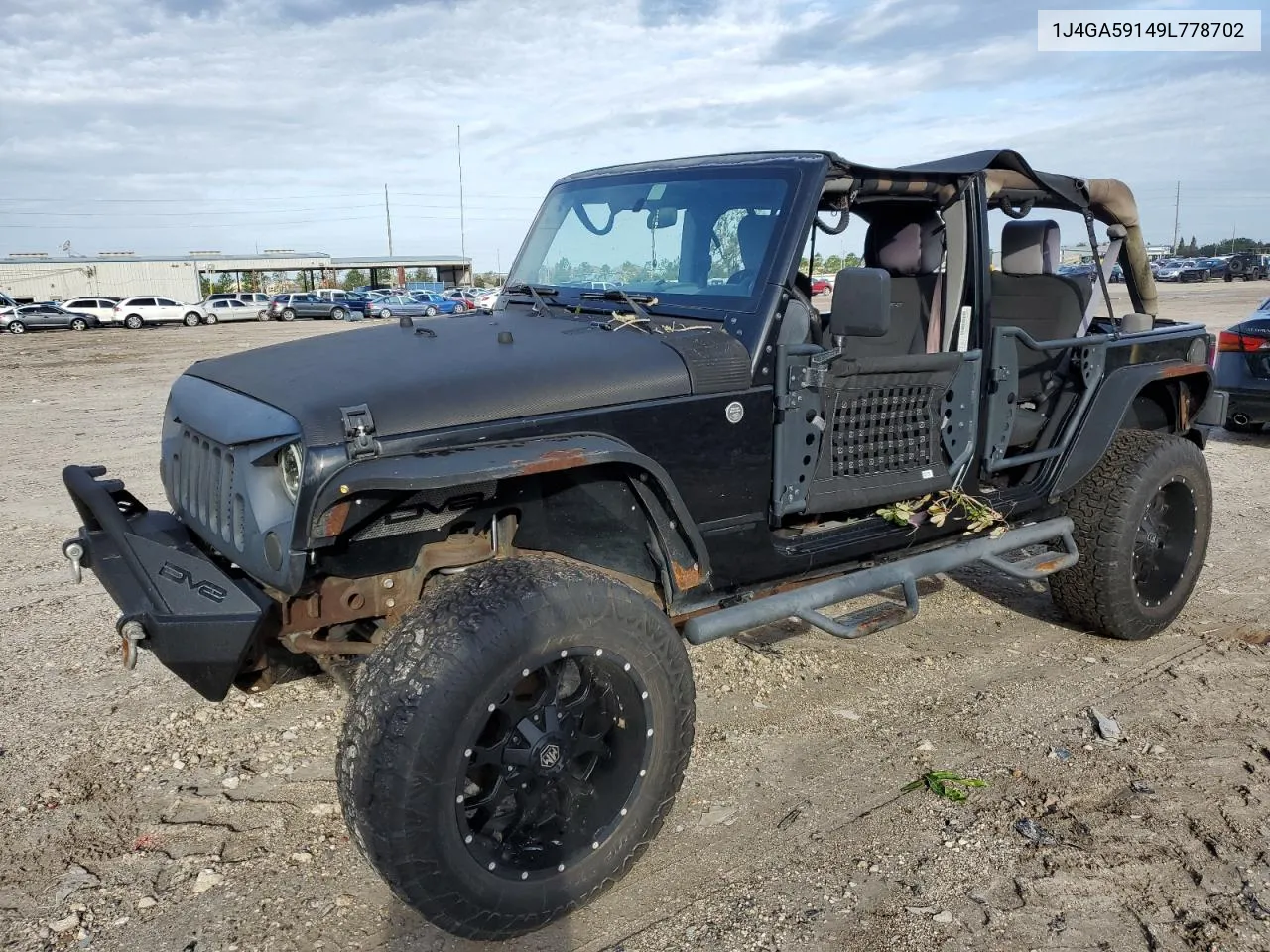 2009 Jeep Wrangler Unlimited Sahara VIN: 1J4GA59149L778702 Lot: 74259274