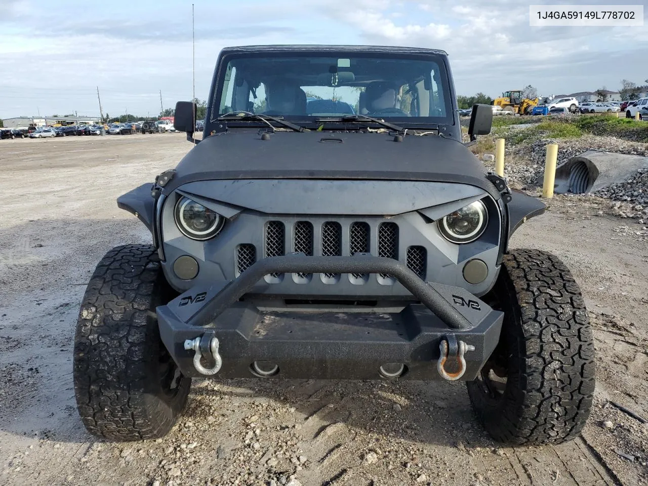 2009 Jeep Wrangler Unlimited Sahara VIN: 1J4GA59149L778702 Lot: 74259274