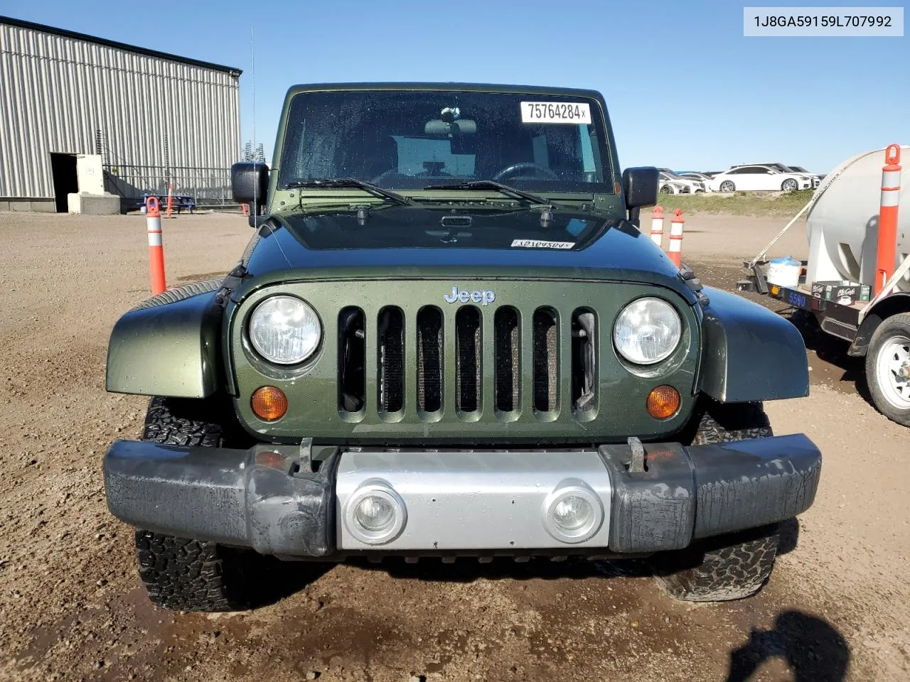 2009 Jeep Wrangler Unlimited Sahara VIN: 1J8GA59159L707992 Lot: 75764284