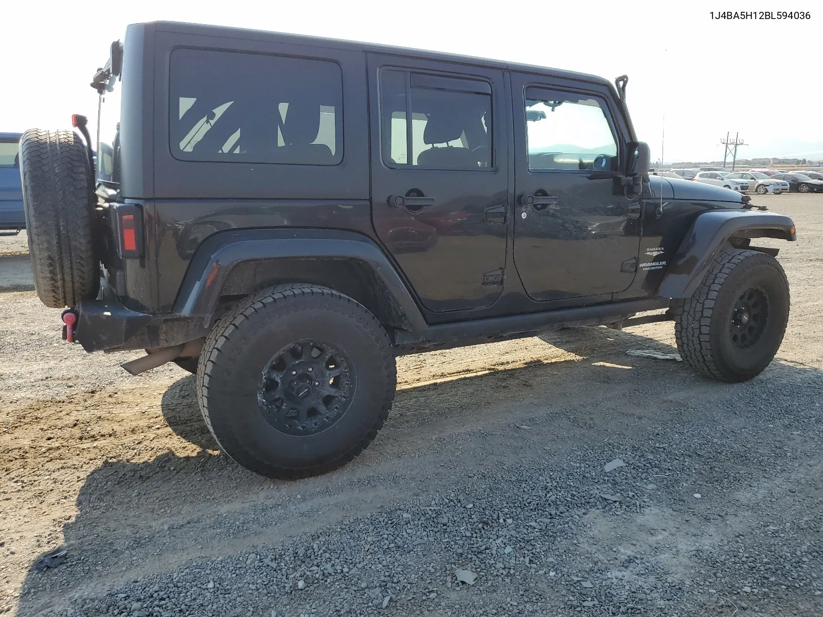 2011 Jeep Wrangler Unlimited Sahara VIN: 1J4BA5H12BL594036 Lot: 62988624