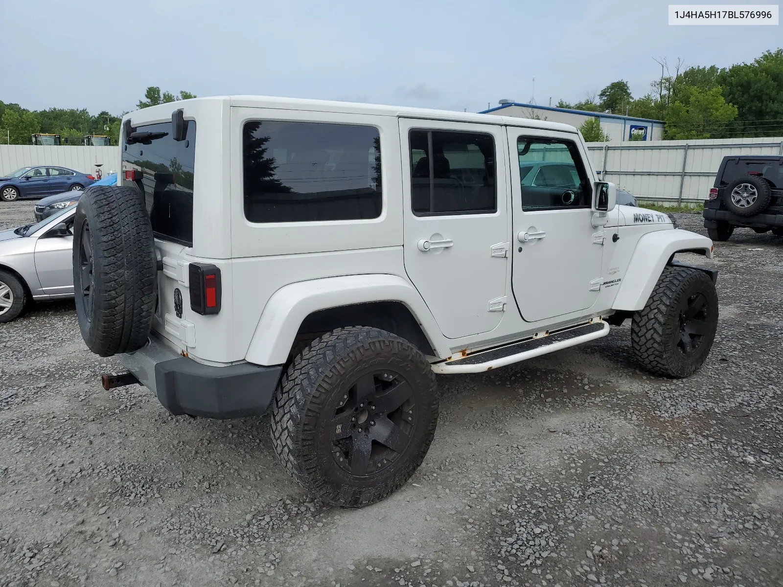 2011 Jeep Wrangler Unlimited Sahara VIN: 1J4HA5H17BL576996 Lot: 63876174