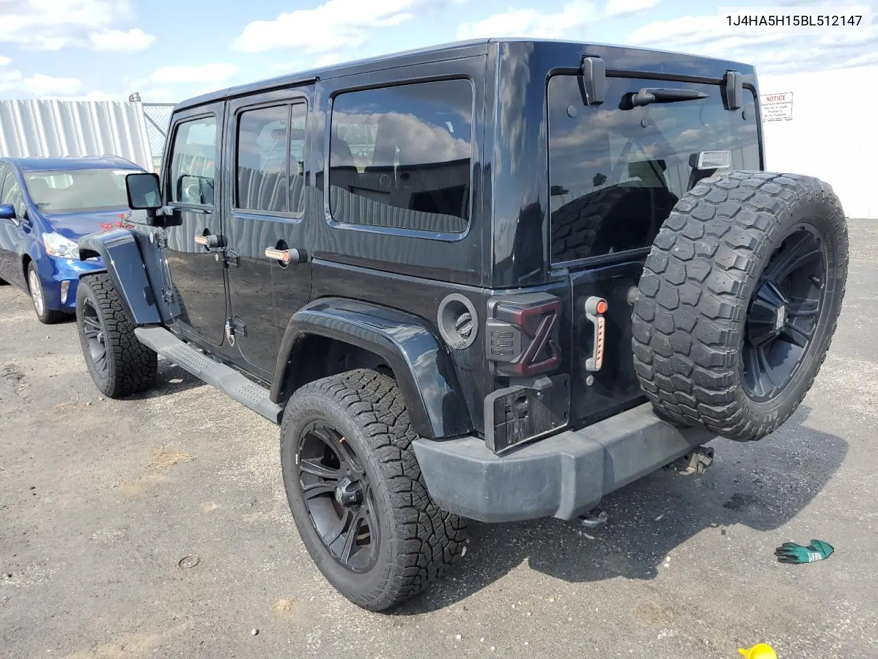 2011 Jeep Wrangler Unlimited Sahara VIN: 1J4HA5H15BL512147 Lot: 64854364