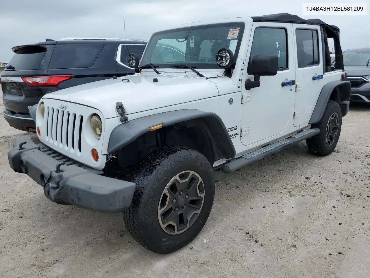 2011 Jeep Wrangler Unlimited Sport VIN: 1J4BA3H12BL581209 Lot: 74675584