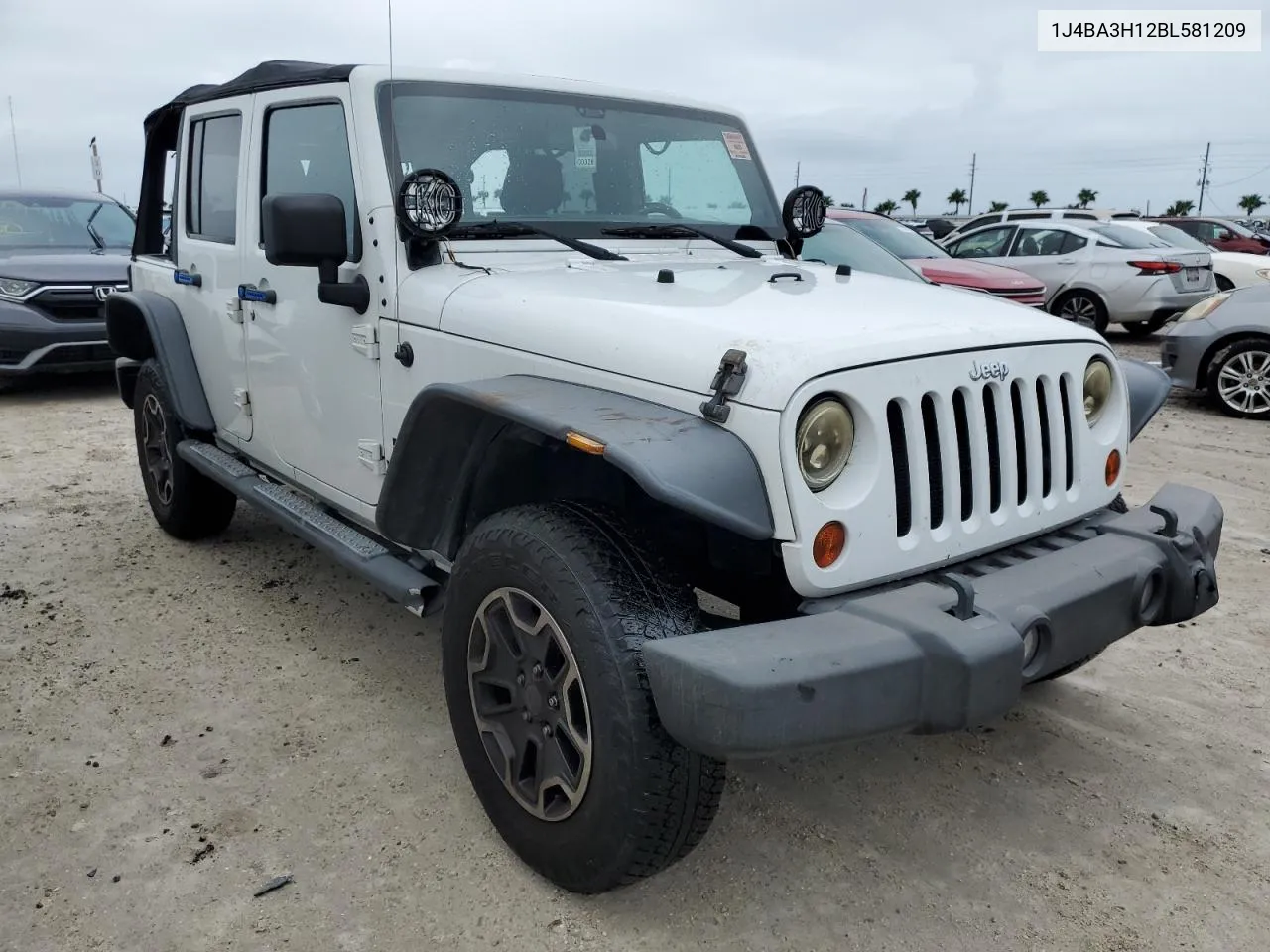 2011 Jeep Wrangler Unlimited Sport VIN: 1J4BA3H12BL581209 Lot: 74675584