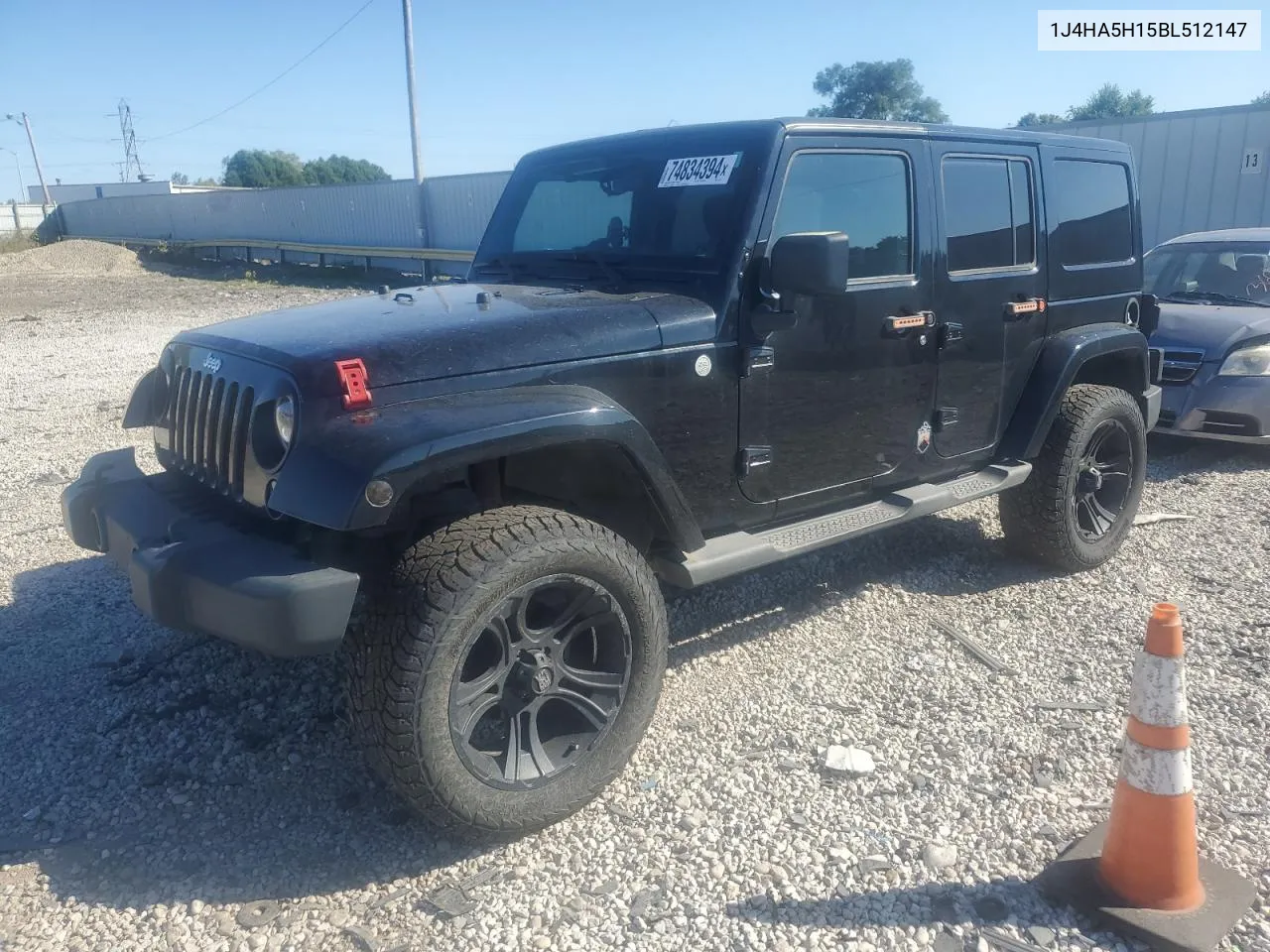 2011 Jeep Wrangler Unlimited Sahara VIN: 1J4HA5H15BL512147 Lot: 74834394