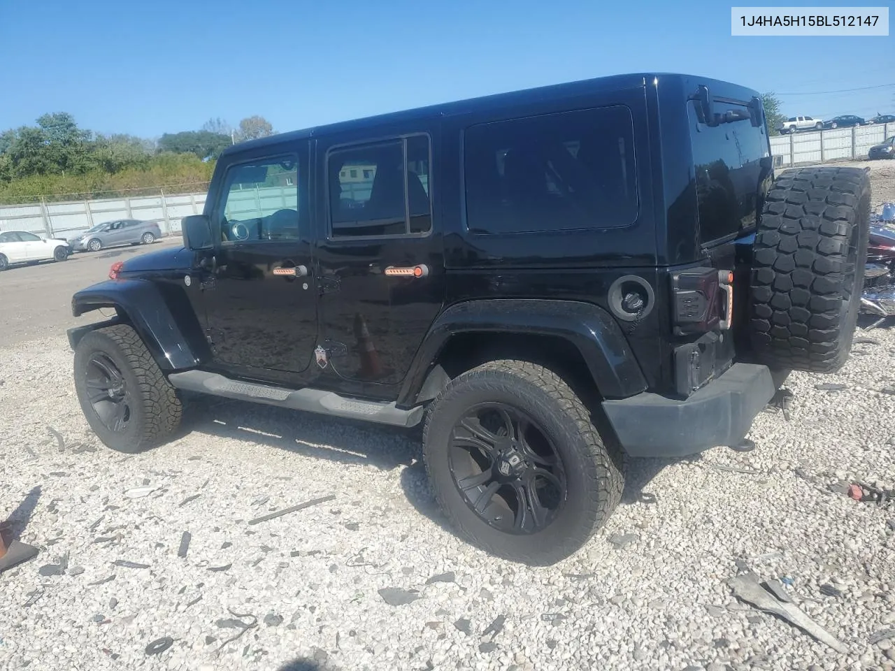 2011 Jeep Wrangler Unlimited Sahara VIN: 1J4HA5H15BL512147 Lot: 74834394