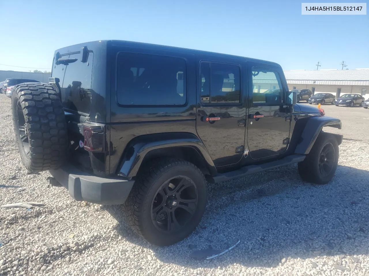 2011 Jeep Wrangler Unlimited Sahara VIN: 1J4HA5H15BL512147 Lot: 74834394