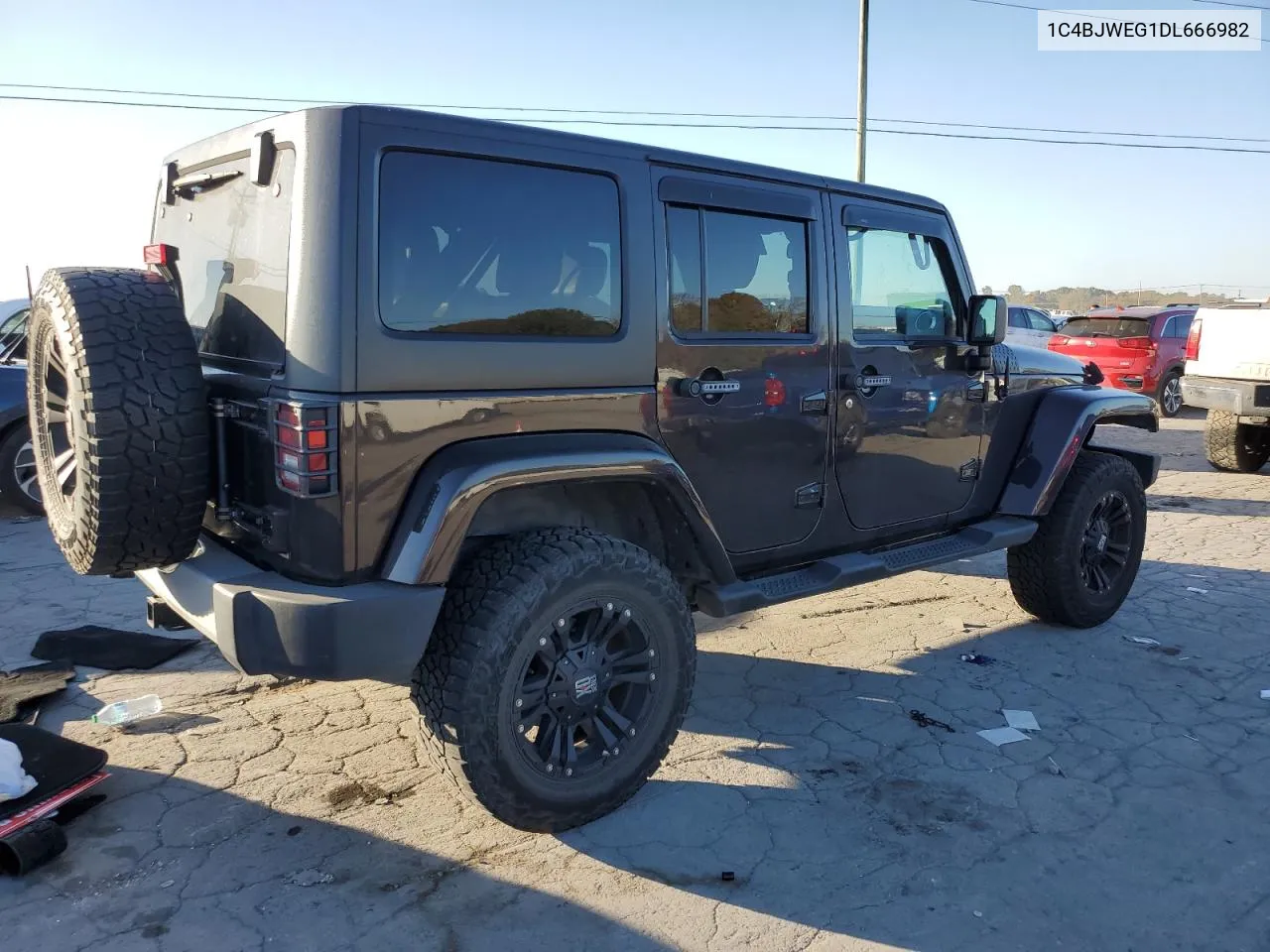 2013 Jeep Wrangler Unlimited Sahara VIN: 1C4BJWEG1DL666982 Lot: 77709634