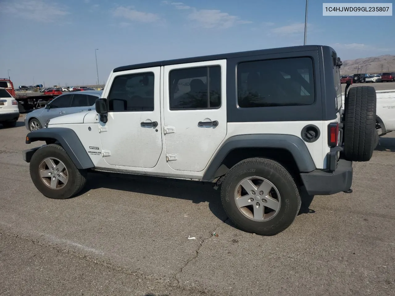 1C4HJWDG9GL235807 2016 Jeep Wrangler Unlimited Sport