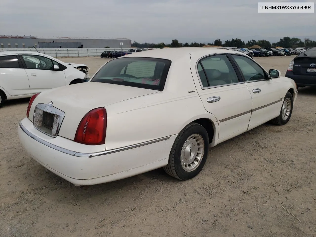 1999 Lincoln Town Car Executive VIN: 1LNHM81W8XY664904 Lot: 75570744