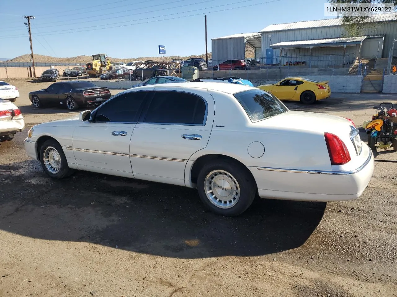 1999 Lincoln Town Car Executive VIN: 1LNHM81W1XY629122 Lot: 77230334