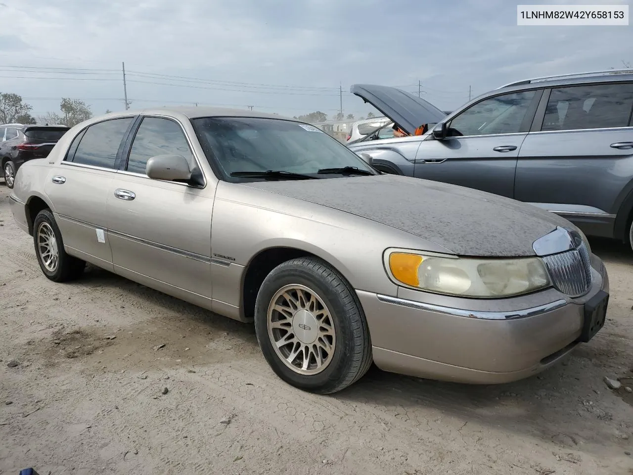 2002 Lincoln Town Car Signature VIN: 1LNHM82W42Y658153 Lot: 76549224