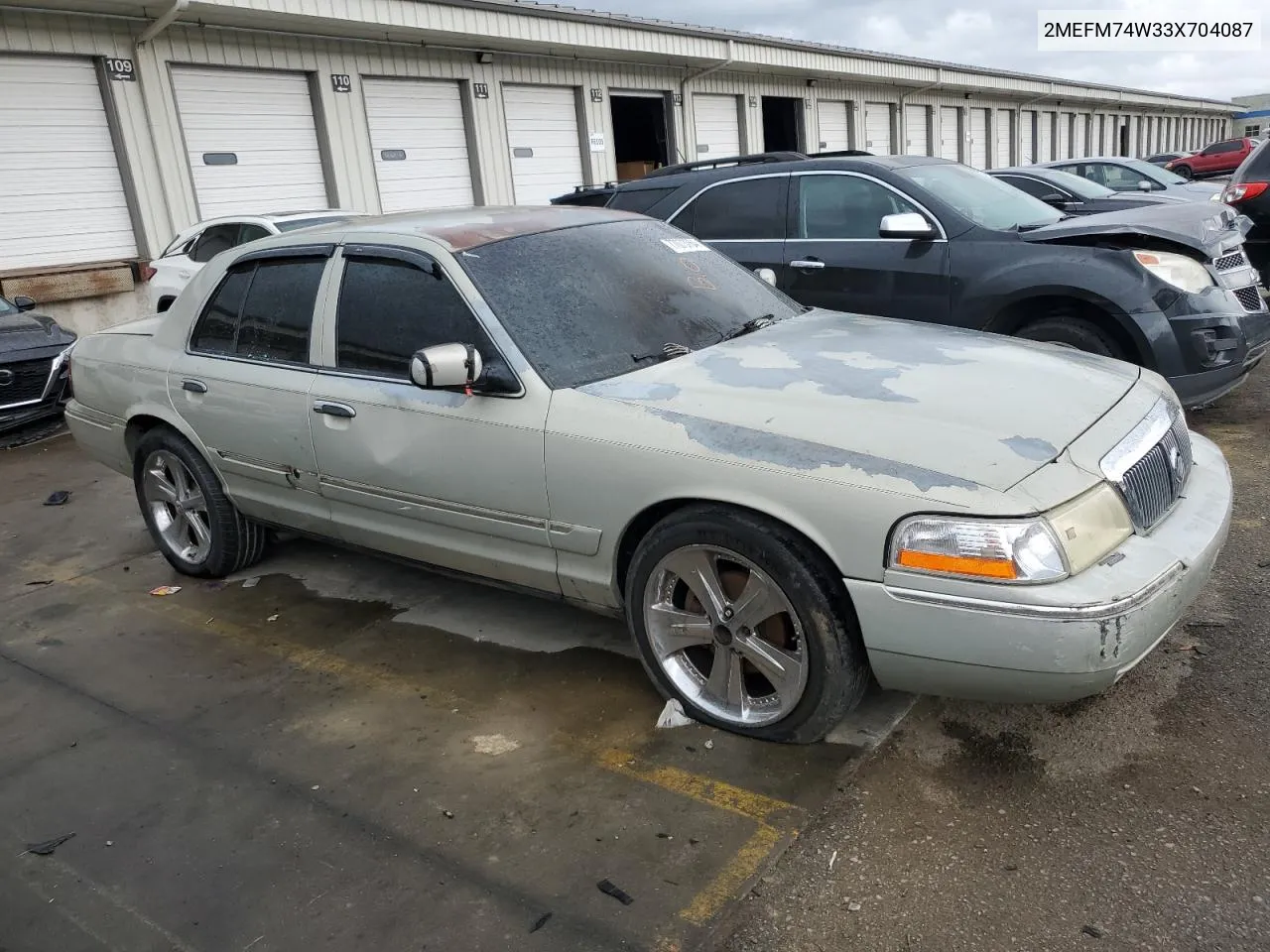 2003 Mercury Grand Marquis Gs VIN: 2MEFM74W33X704087 Lot: 77073764