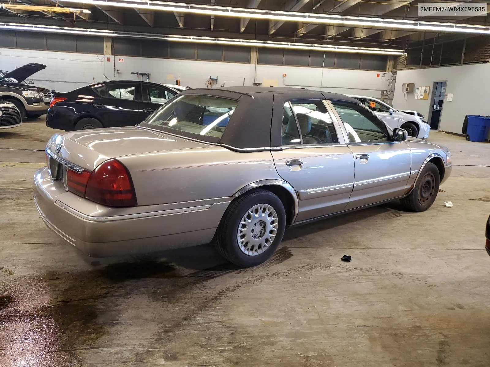 2004 Mercury Grand Marquis Gs VIN: 2MEFM74W84X696585 Lot: 49645694