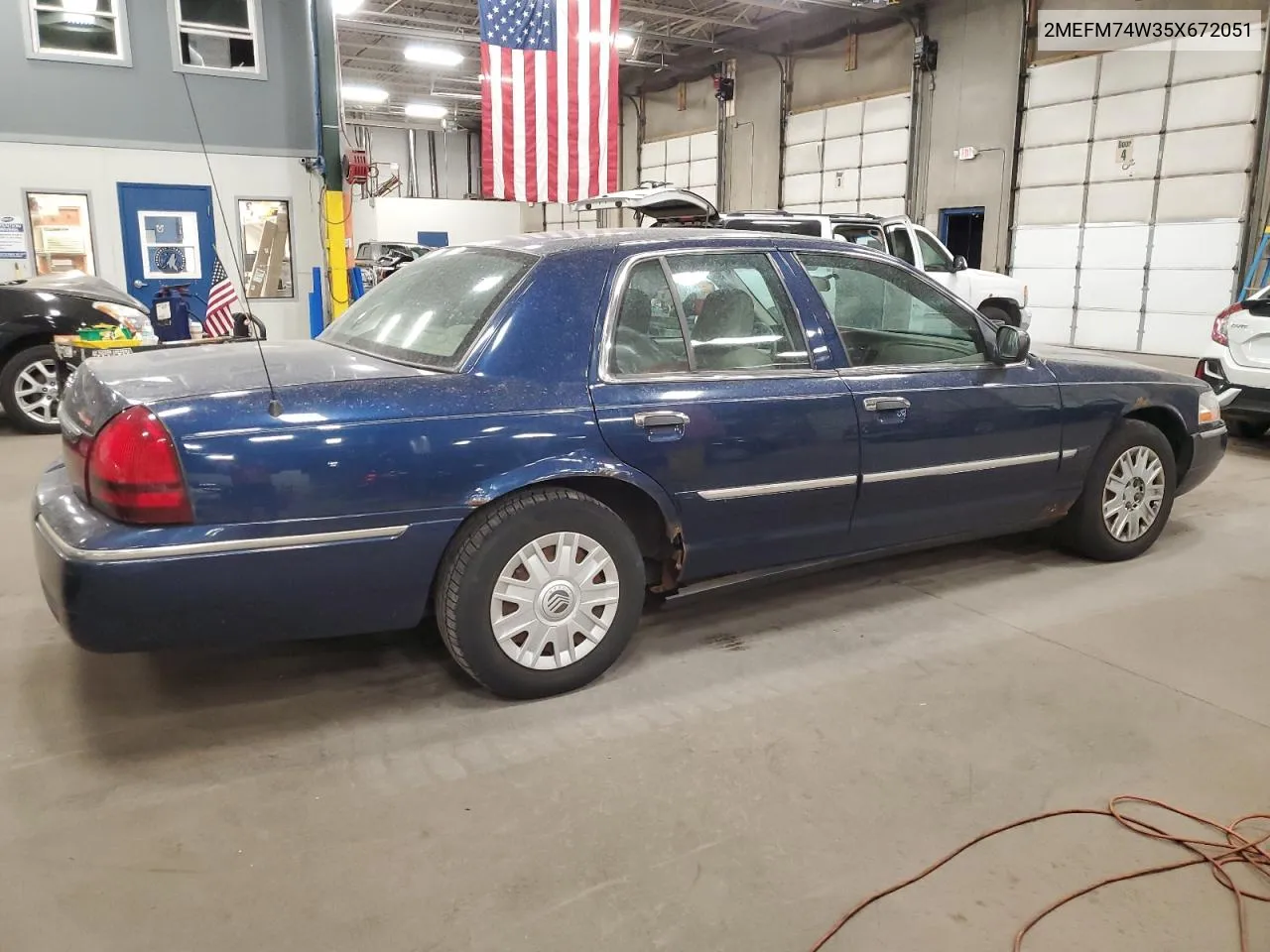 2005 Mercury Grand Marquis Gs VIN: 2MEFM74W35X672051 Lot: 75477324