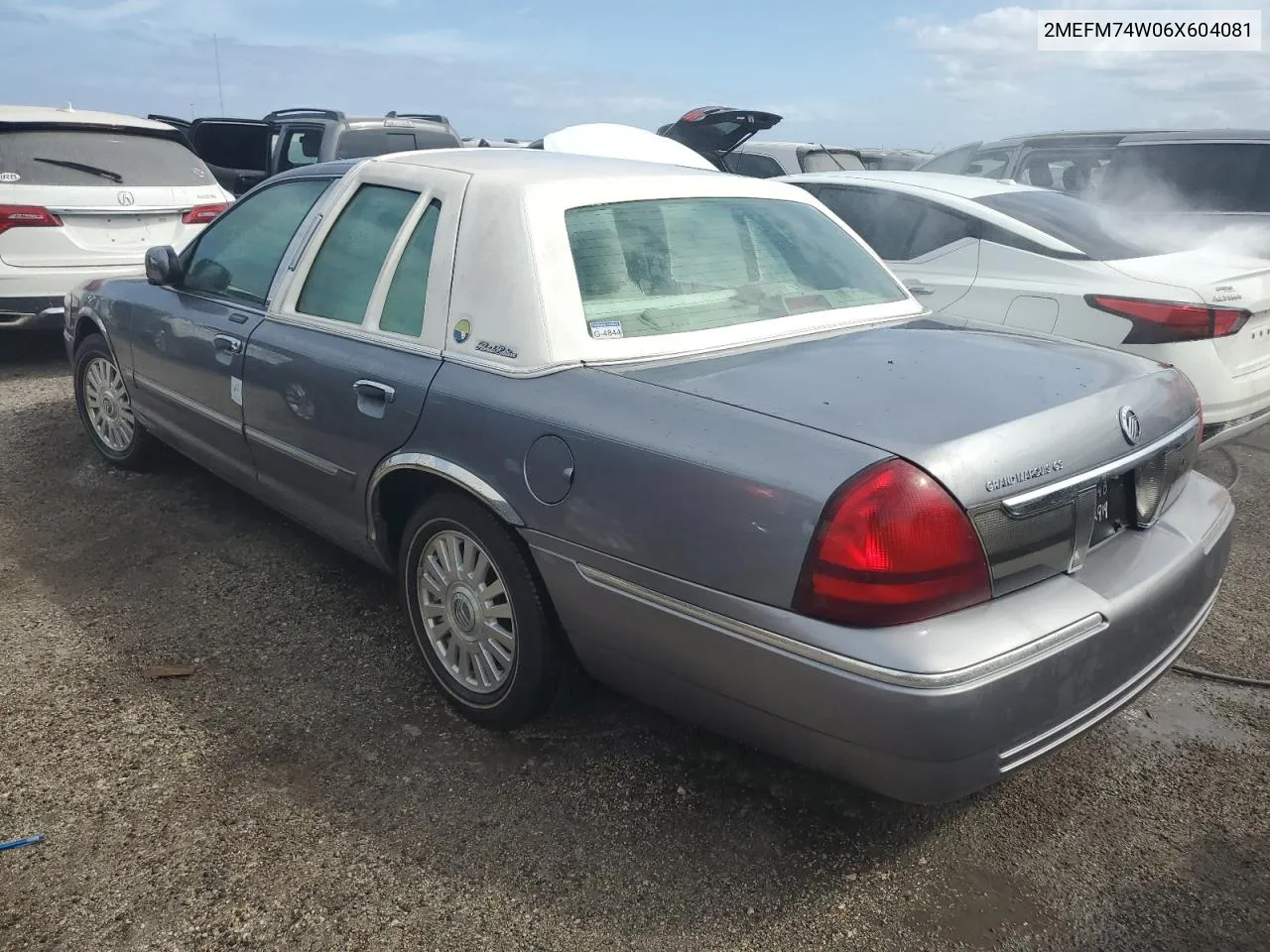 2006 Mercury Grand Marquis Gs VIN: 2MEFM74W06X604081 Lot: 76267974