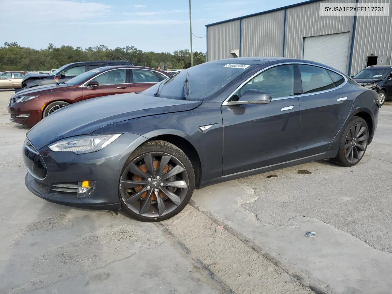 2015 Tesla Model S VIN: 5YJSA1E2XFF117231 Lot: 74992934