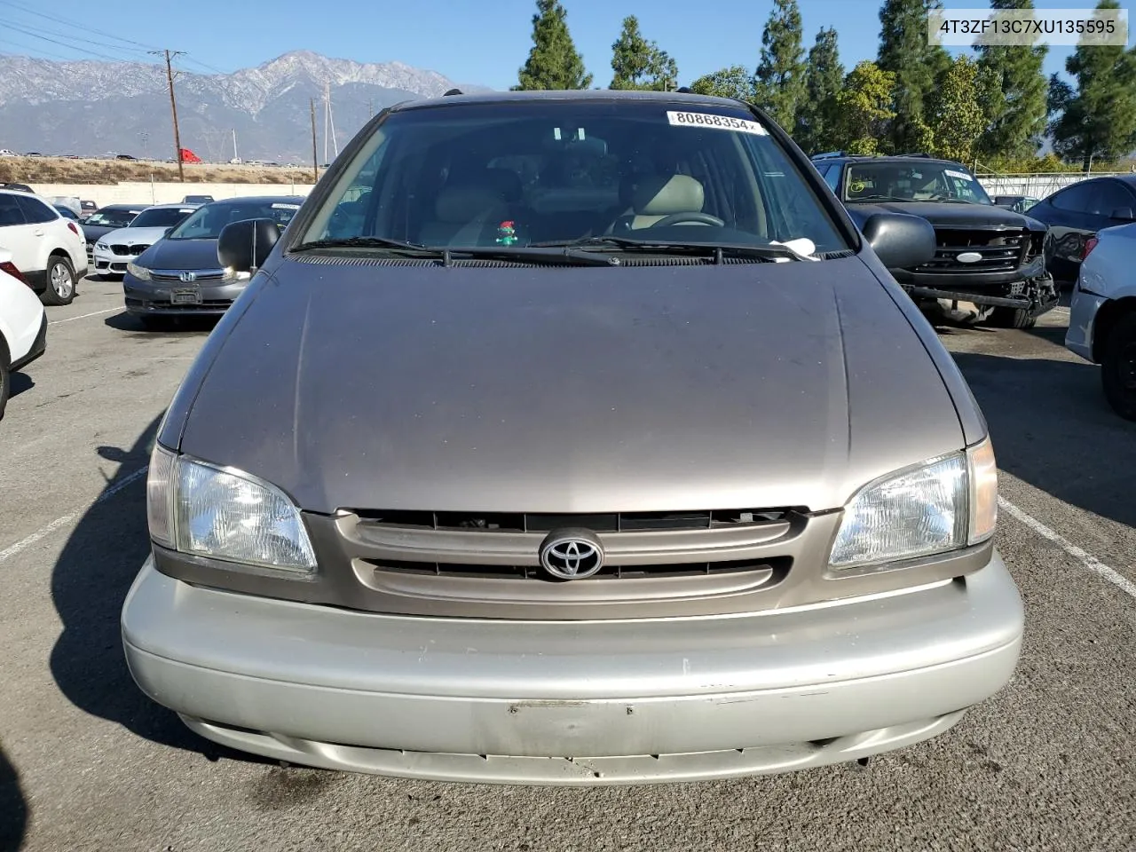 1999 Toyota Sienna Le VIN: 4T3ZF13C7XU135595 Lot: 80868354