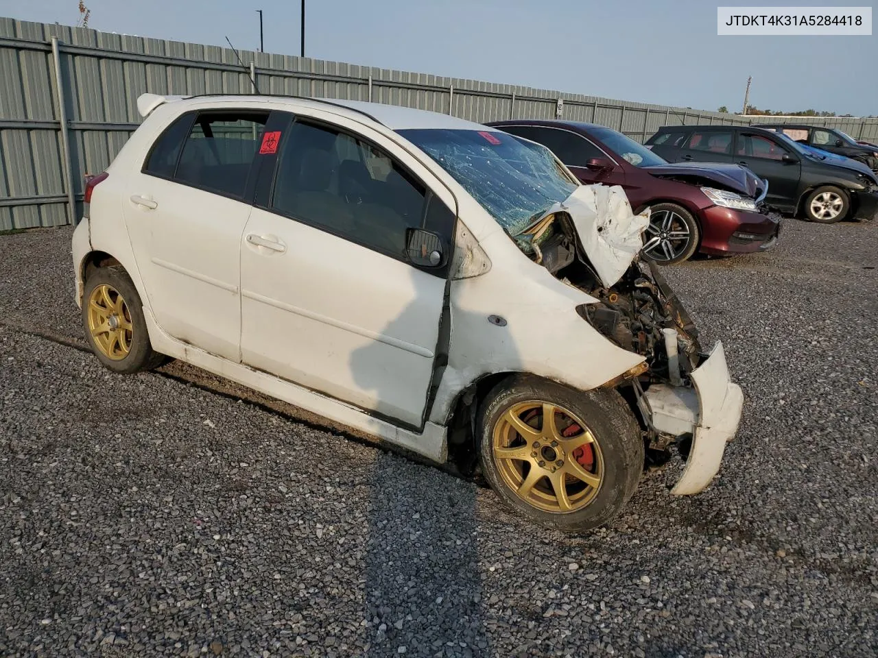 2010 Toyota Yaris VIN: JTDKT4K31A5284418 Lot: 74913934