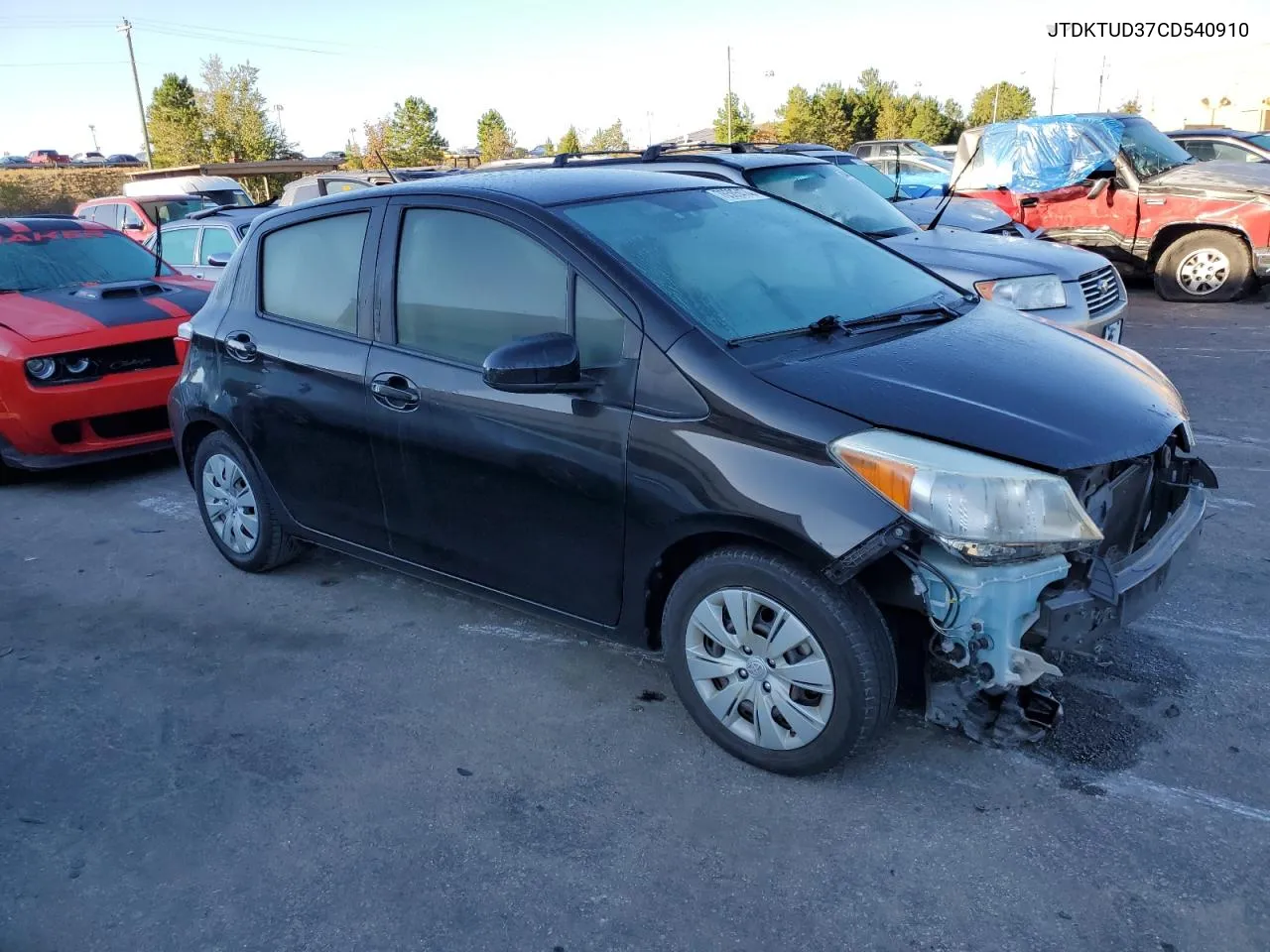 2012 Toyota Yaris VIN: JTDKTUD37CD540910 Lot: 76585474