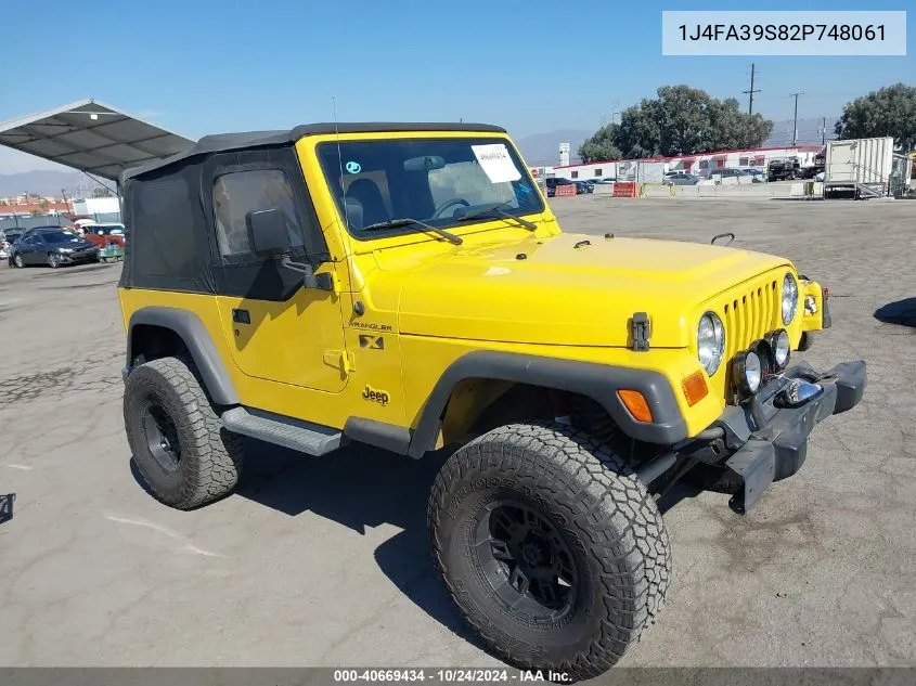 2002 Jeep Wrangler X VIN: 1J4FA39S82P748061 Lot: 40669434