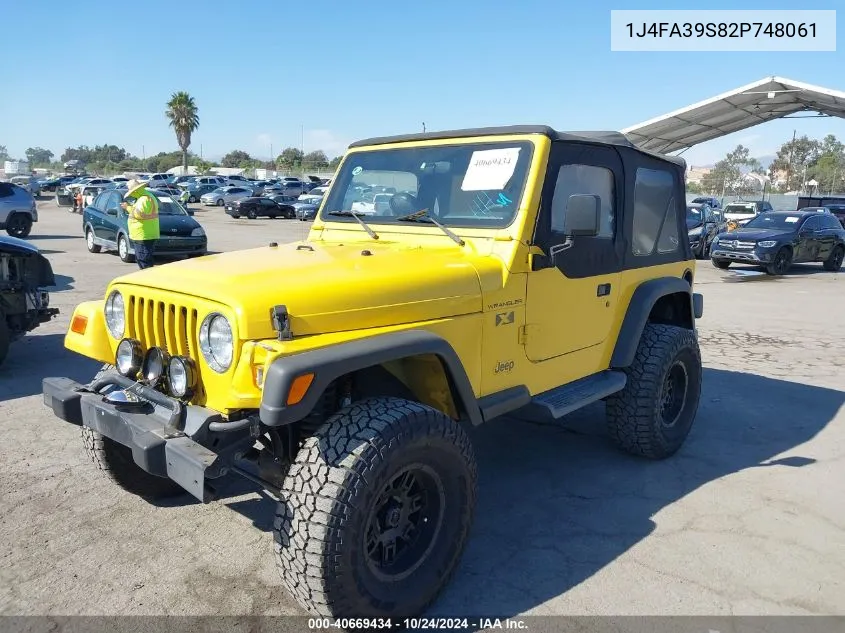 2002 Jeep Wrangler X VIN: 1J4FA39S82P748061 Lot: 40669434