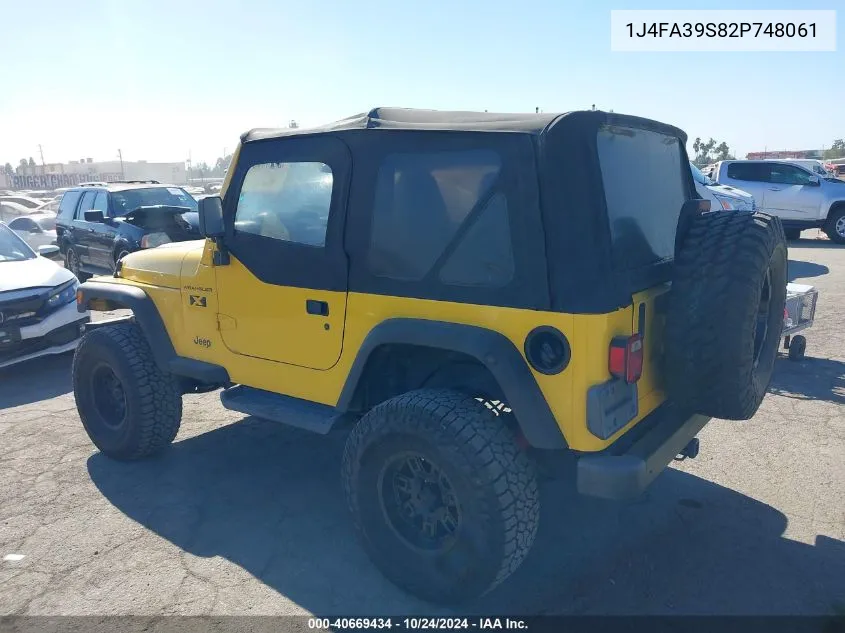 2002 Jeep Wrangler X VIN: 1J4FA39S82P748061 Lot: 40669434