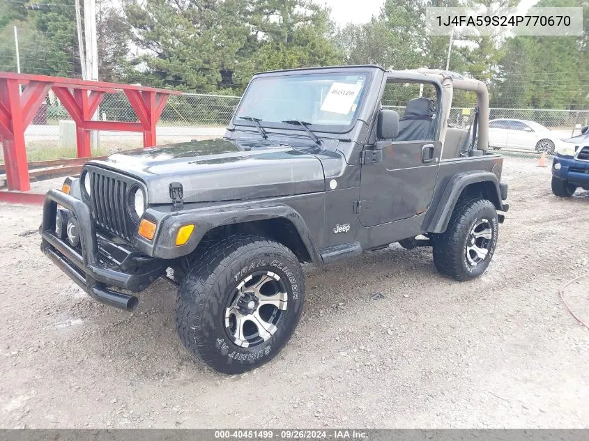 1J4FA59S24P770670 2004 Jeep Wrangler Sahara